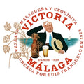 Logo of Victoria Malaga beer with a man holding a beer mug and a bottle, set against a scenic background.